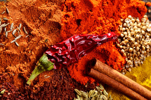 istock Various colorful spices on a wooden board 638653286