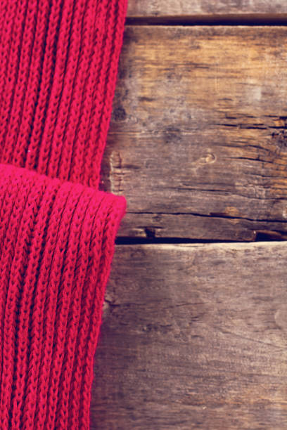 istock knitted plaid, sweater on old wooden boards 638653910