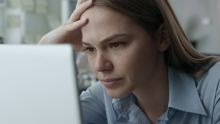 Exhausted young businesswoman