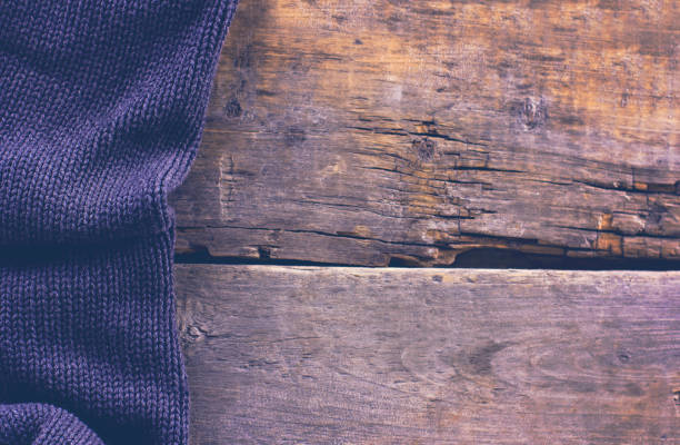 istock knitted plaid, sweater on old wooden boards 638655900
