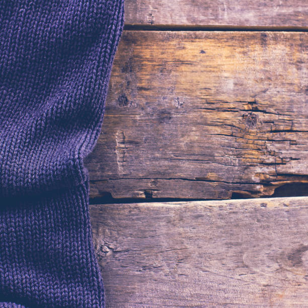 istock knitted plaid, sweater on old wooden boards 638655998