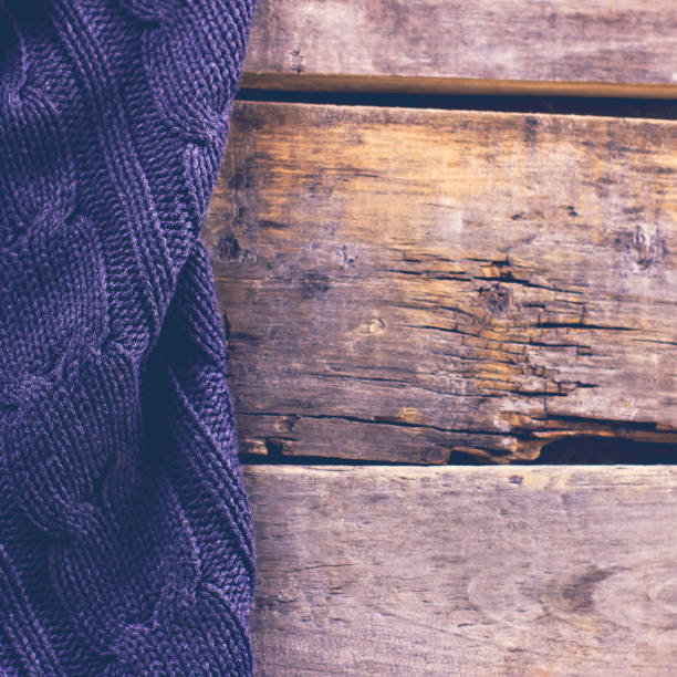 istock knitted plaid, sweater on old wooden boards 638656222