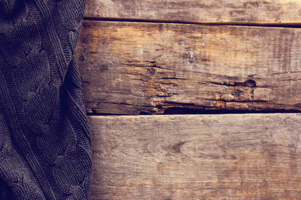 istock knitted plaid, sweater on old wooden boards 638656288
