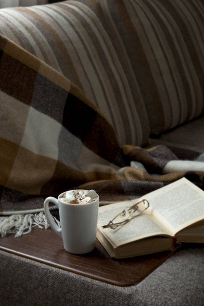 istock Cup of hot coffee with marmalade book points the blanket 638656308