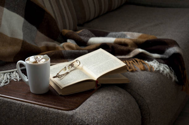 istock Cup of hot coffee with marmalade book points the blanket 638656342