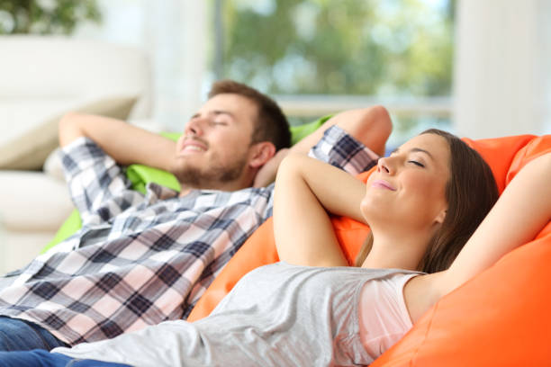 istock Couple or roommates relaxing at home 638657234