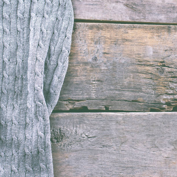istock knitted plaid, sweater on old wooden boards 638658758