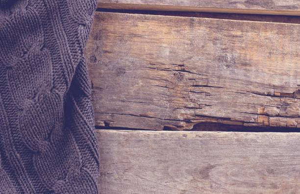 istock knitted plaid, sweater on old wooden boards 638659180