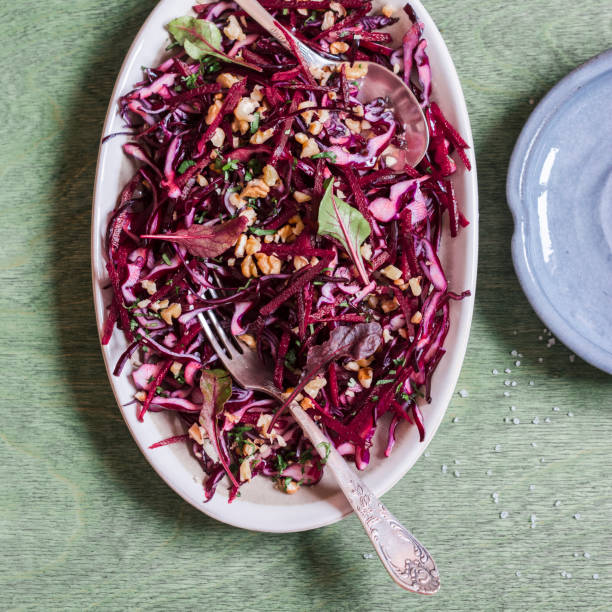 istock Red cabbage, beetroot and walnuts salad. Healthy vegetarian detox food 638659396