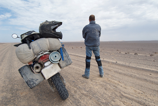 adventure rider stops to look at the view in namib desert