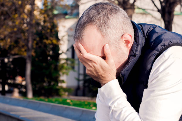 istock Portrait stressed young man hands on head with bad headache 638660086