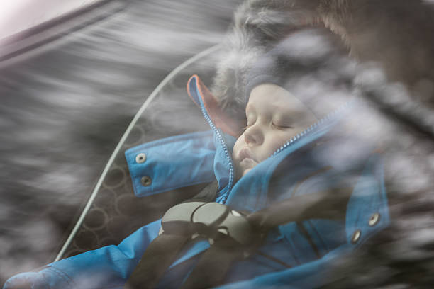 baby sleeping in car seat, winter season - car baby baby car seat child imagens e fotografias de stock