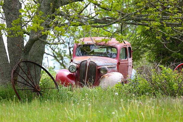 istock Antique car in a field, abandoned 638661350