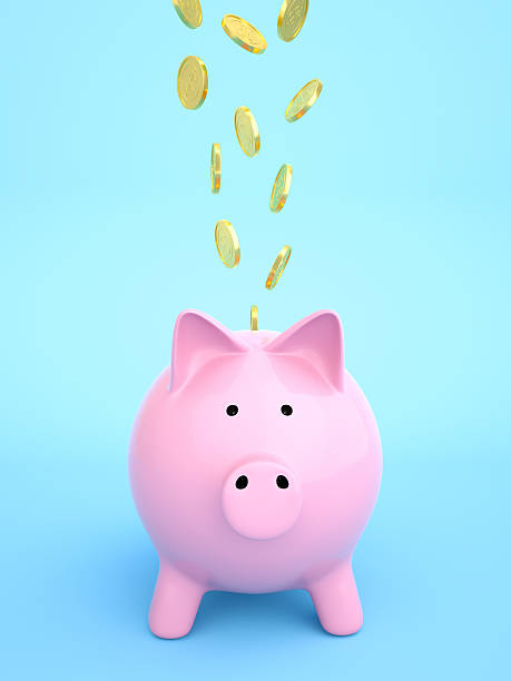 istock Piggy bank with coins falling into slot 638661536