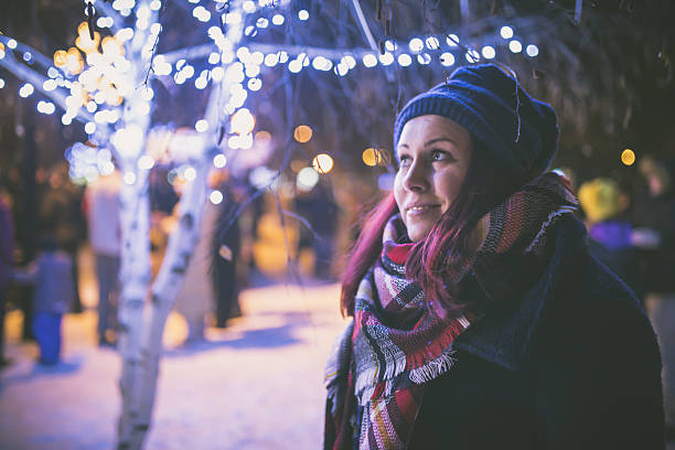 istock woman in night winter city 638664086