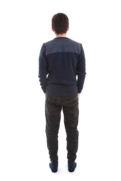 istock Rear view of casual young man standing 638664866