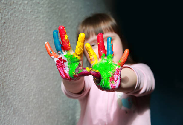 istock Cute little girl with painted hands. 638664876