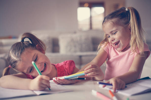 istock Cute little girls drawing. 638664992