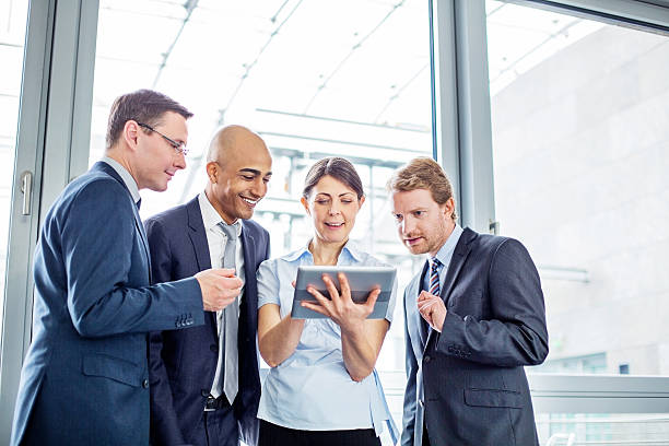 istock Business colleagues discussing over digital table 638666284