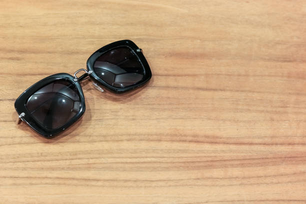 istock Sunglasses on the wooden table with copy space 638666592