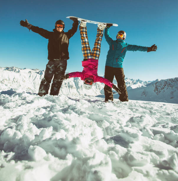 Group friends snowboarders have fun on the slope