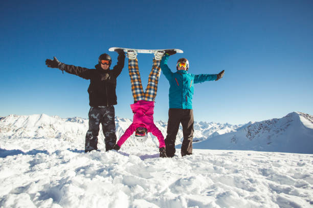 istock Group friends snowboarders have fun on the slope 638666764