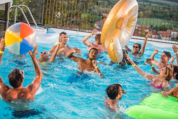 istock Friends enjoying in swimming pool 638667210