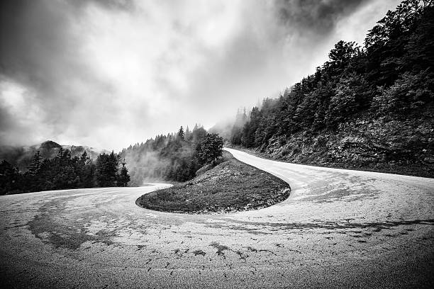 istock winding mountain road in the clouds 638667392