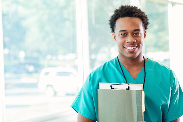 Confident medical student before class Handsome African American healthcare professional attends conference. medical student photos stock pictures, royalty-free photos & images