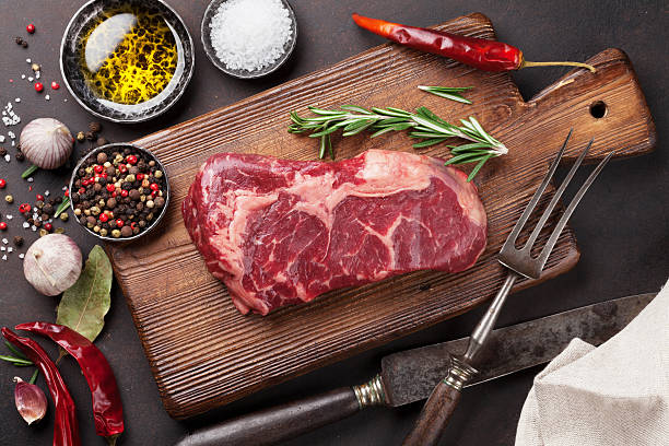 istock Raw ribeye beef steak cooking with ingredients 638669318