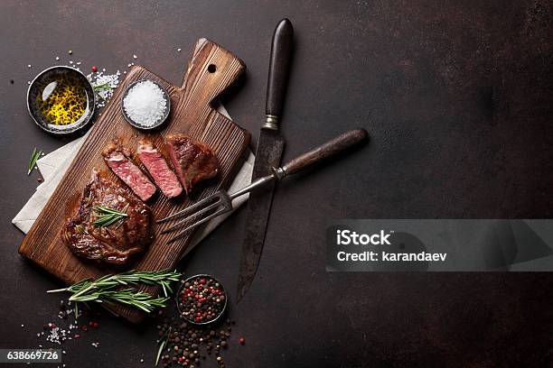 Grilled Ribeye Beef Steak Herbs And Spices Stock Photo - Download Image Now - Meat, Steak, Barbecue - Meal
