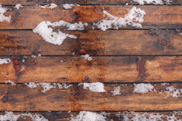 istock Winter background with wooden floor covered by snow 638670206