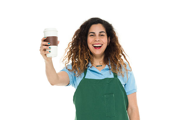 istock Cheerful barista holding coffee cup 638670362
