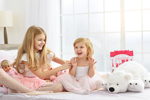 istock Little sisters enjoying time together at home 638671132