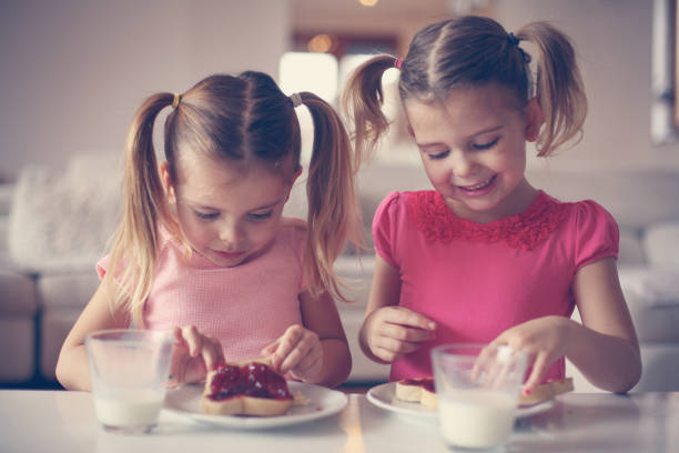 istock Girls eating breakfast. 638671190