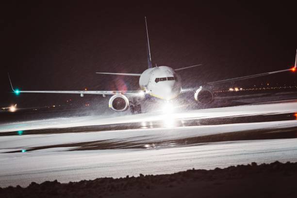 istock Passenger airplane takes off during heavy snow 638671356