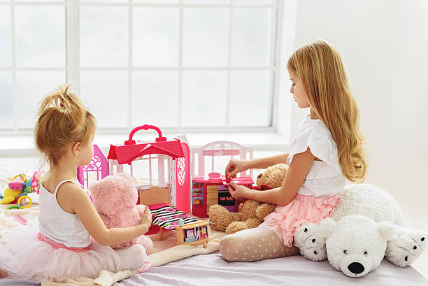 istock Cute two sisters playing with toys 638672916