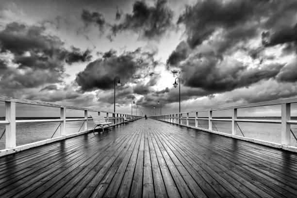 istock Calm Baltic Sea with illuminated pier 638673460