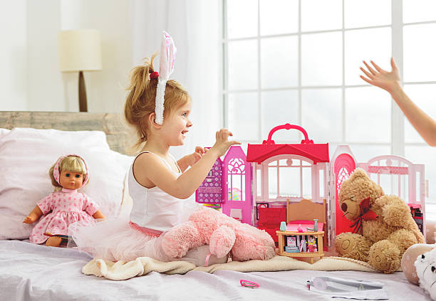 istock Cheerful female child entertaining at home 638674094