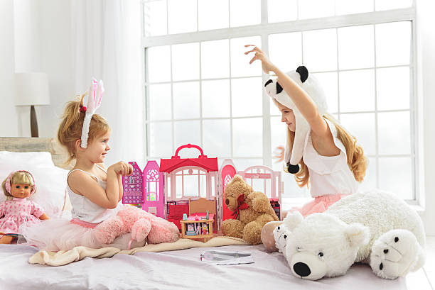 istock Carefree siblings having fun in bedroom 638674234