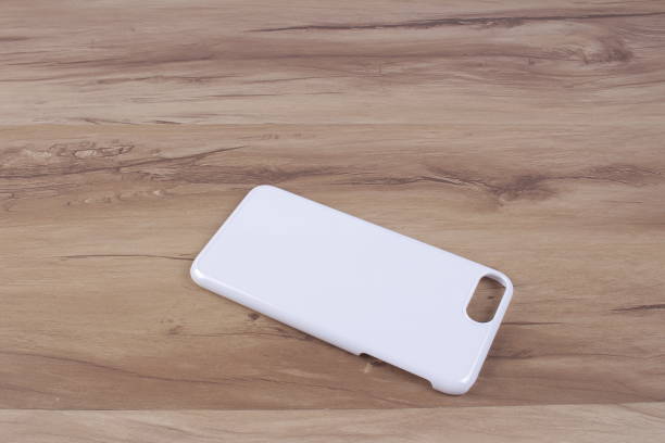 istock Case for smart phone on wood background 638674270