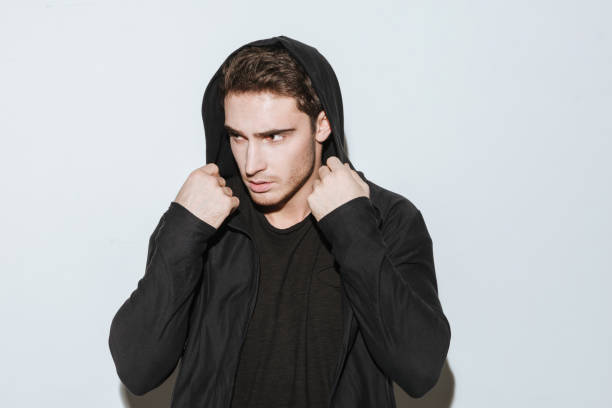 istock Young attractive man dressed in black t-shirt and mantle 638674820