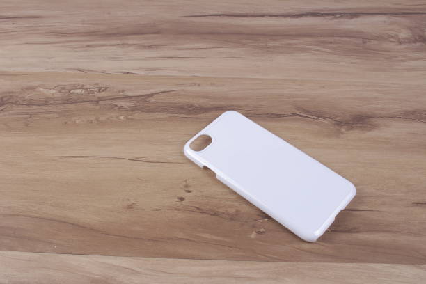istock Case for smart phone on wood background 638674910