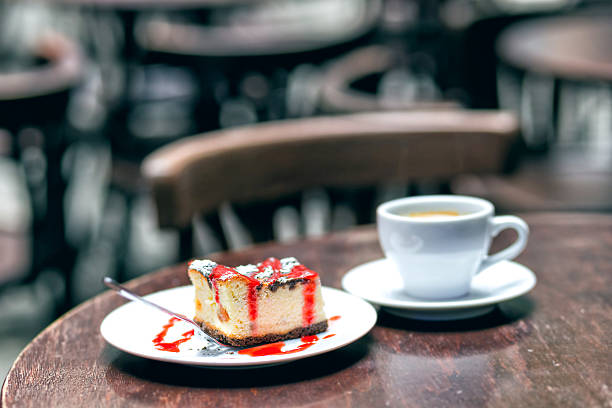 istock Slice of cheesecake with cherry and cup tea 638676896