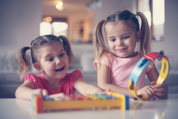 istock Two little girl at music school. 638677076