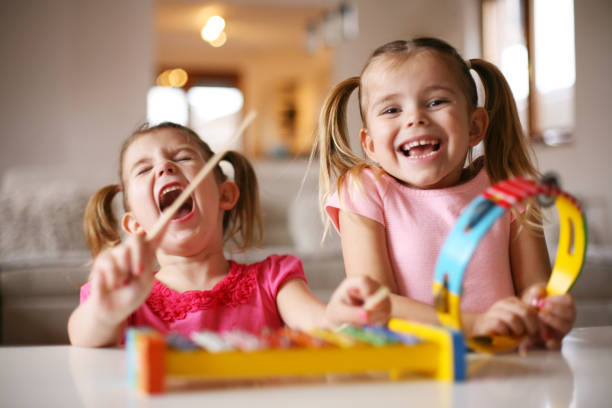 two little girl at music school. - singing lesson imagens e fotografias de stock