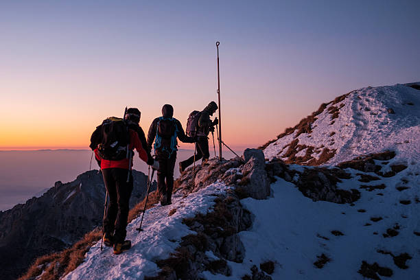 istock Group of hikers walking on top of the mountain range 638677286