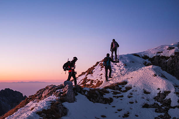 istock Group of hikers walking on top of the mountain range 638677298