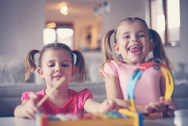 istock Two little girl at music school. 638677376