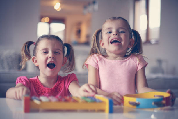 istock Two little girl at music school. 638677566